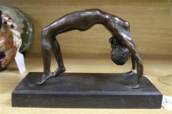 A bronze figure of an acrobat, signed Milo length 25cm